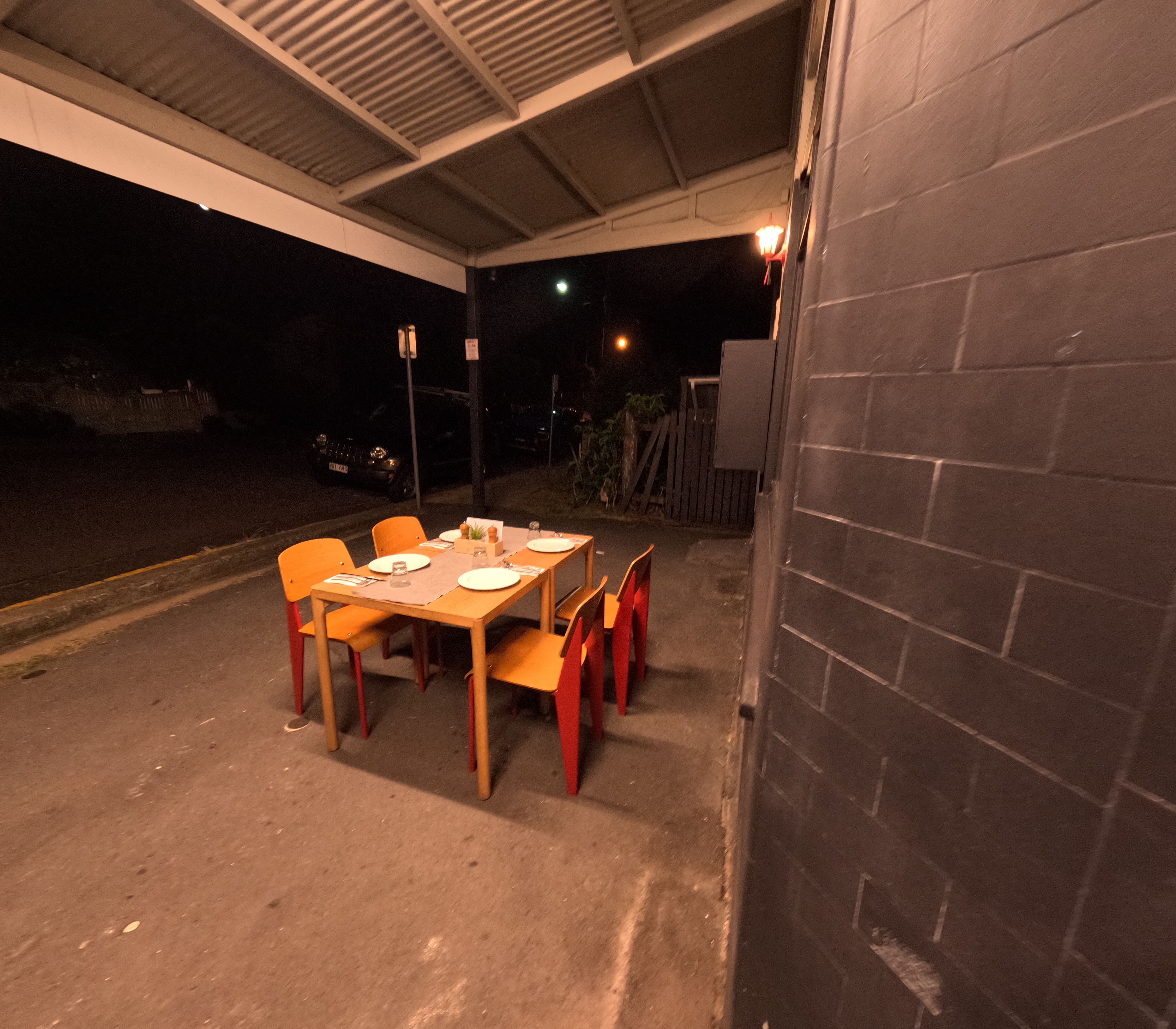 Bema Kitchen outdoor patio dining at night